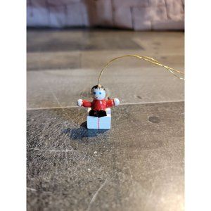 Wooden girl on‎ present ornament xmas